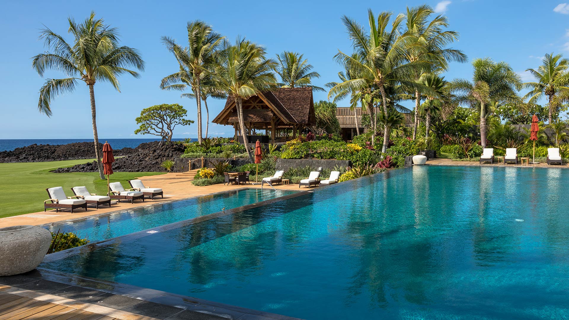 Tranquil waters of the pool, steps from the ocean’s rolling waves